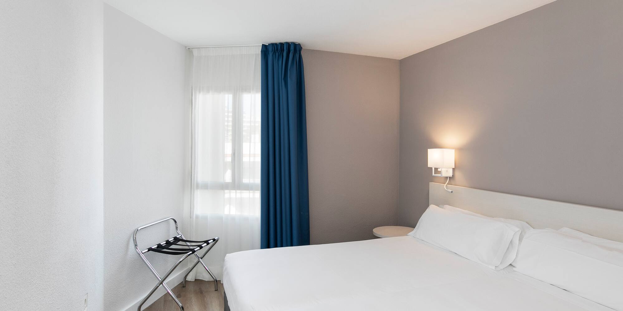 a room with a bed and a chair