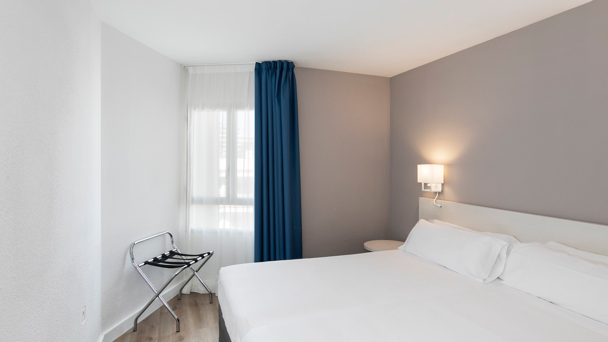 a room with a bed and a chair