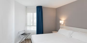 a room with a bed and a chair