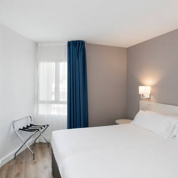 a room with a bed and a chair