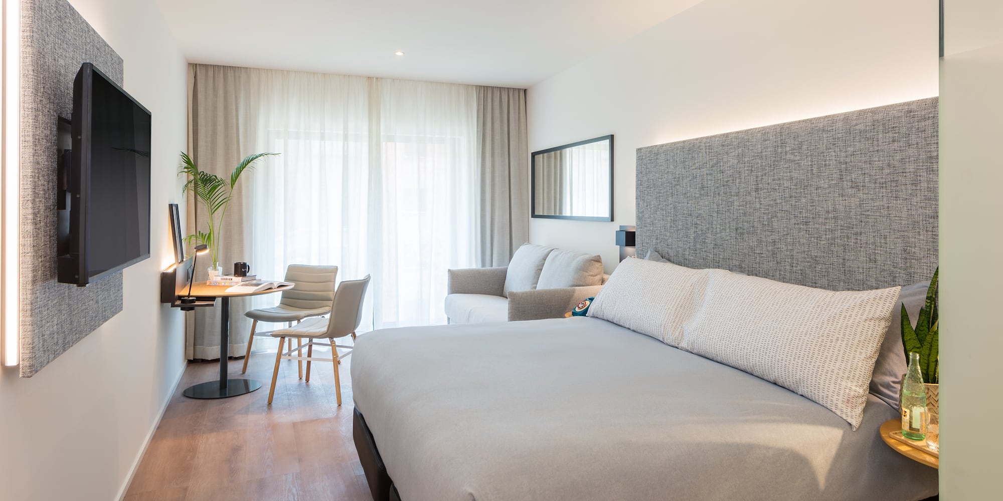 a bedroom with a bed and a desk