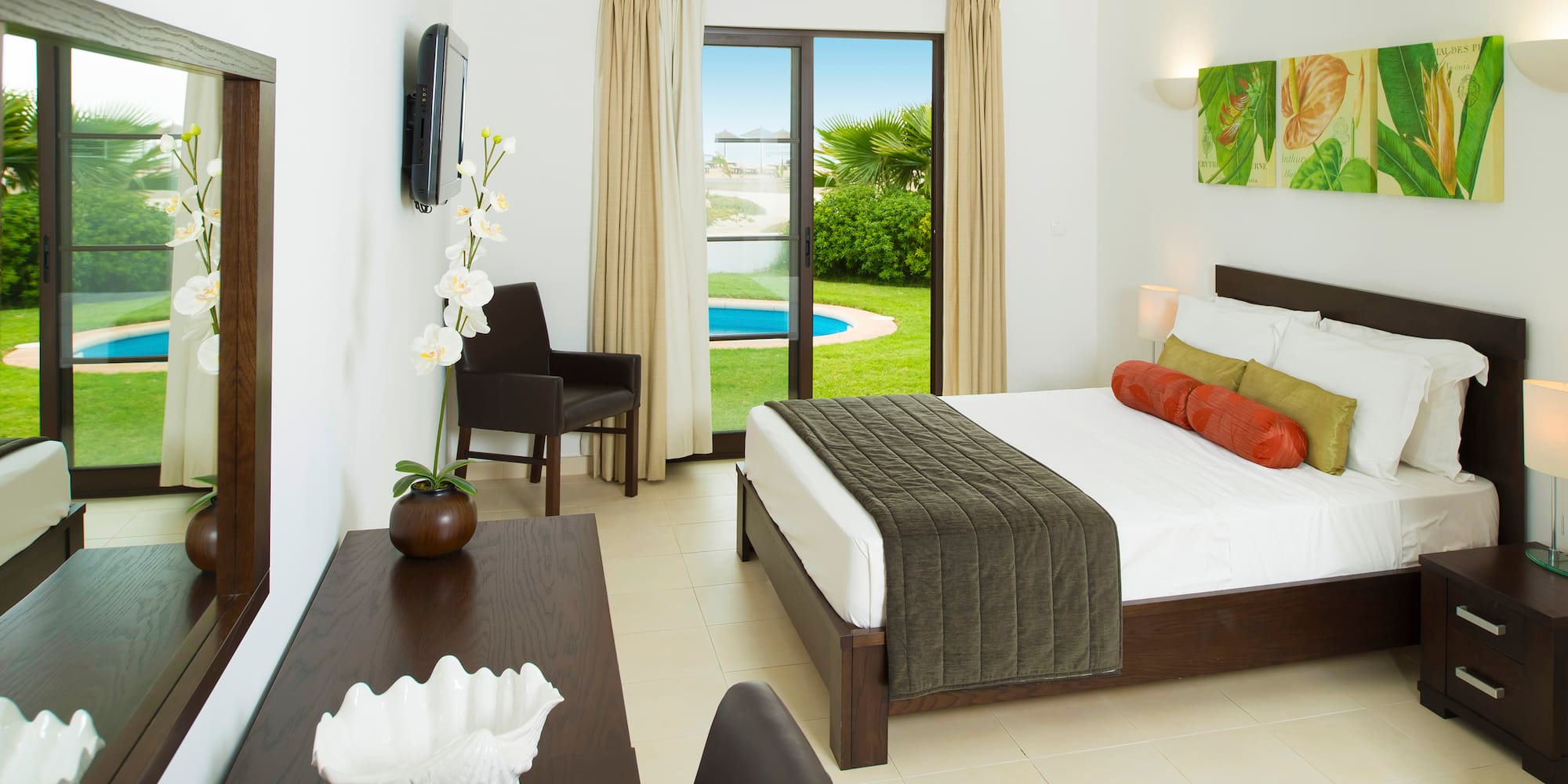 a bedroom with a bed and a table