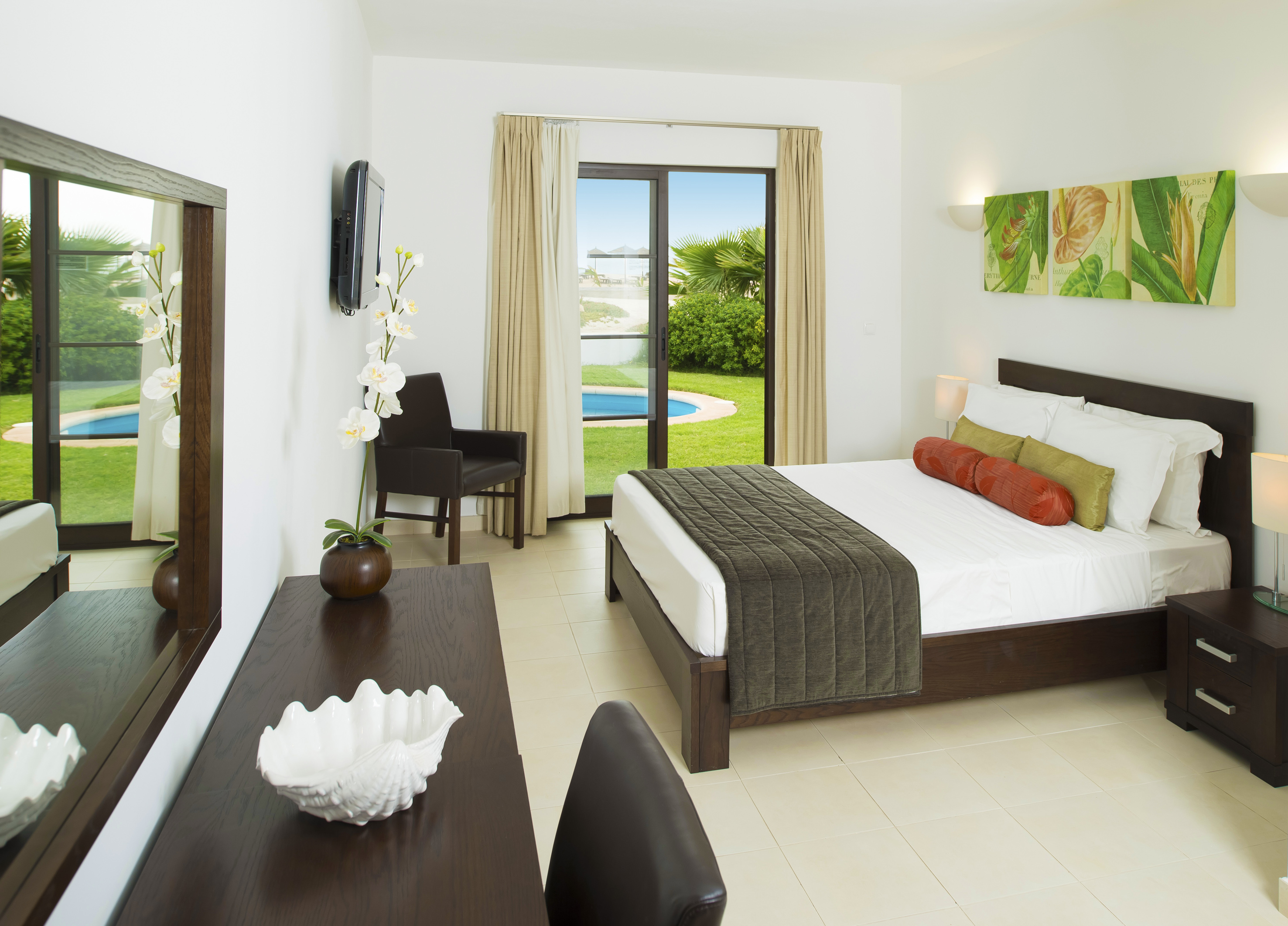 a bedroom with a bed and a table