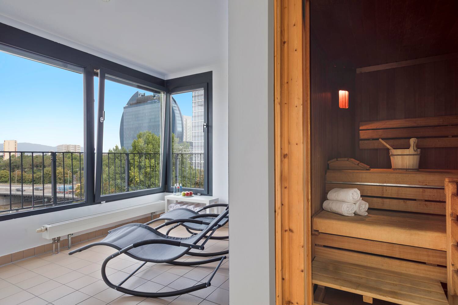 a room with chairs and a sauna