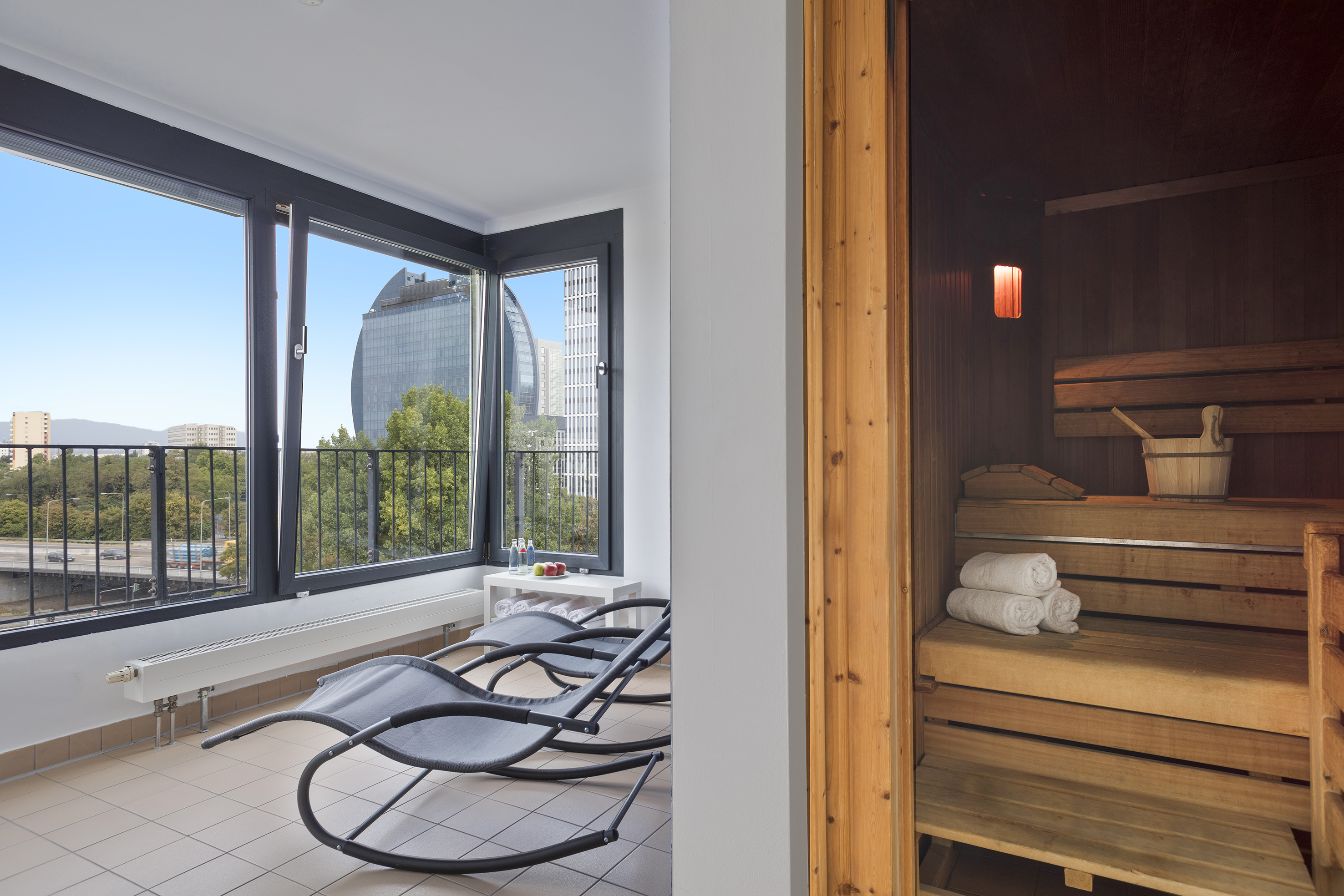 a room with chairs and a sauna