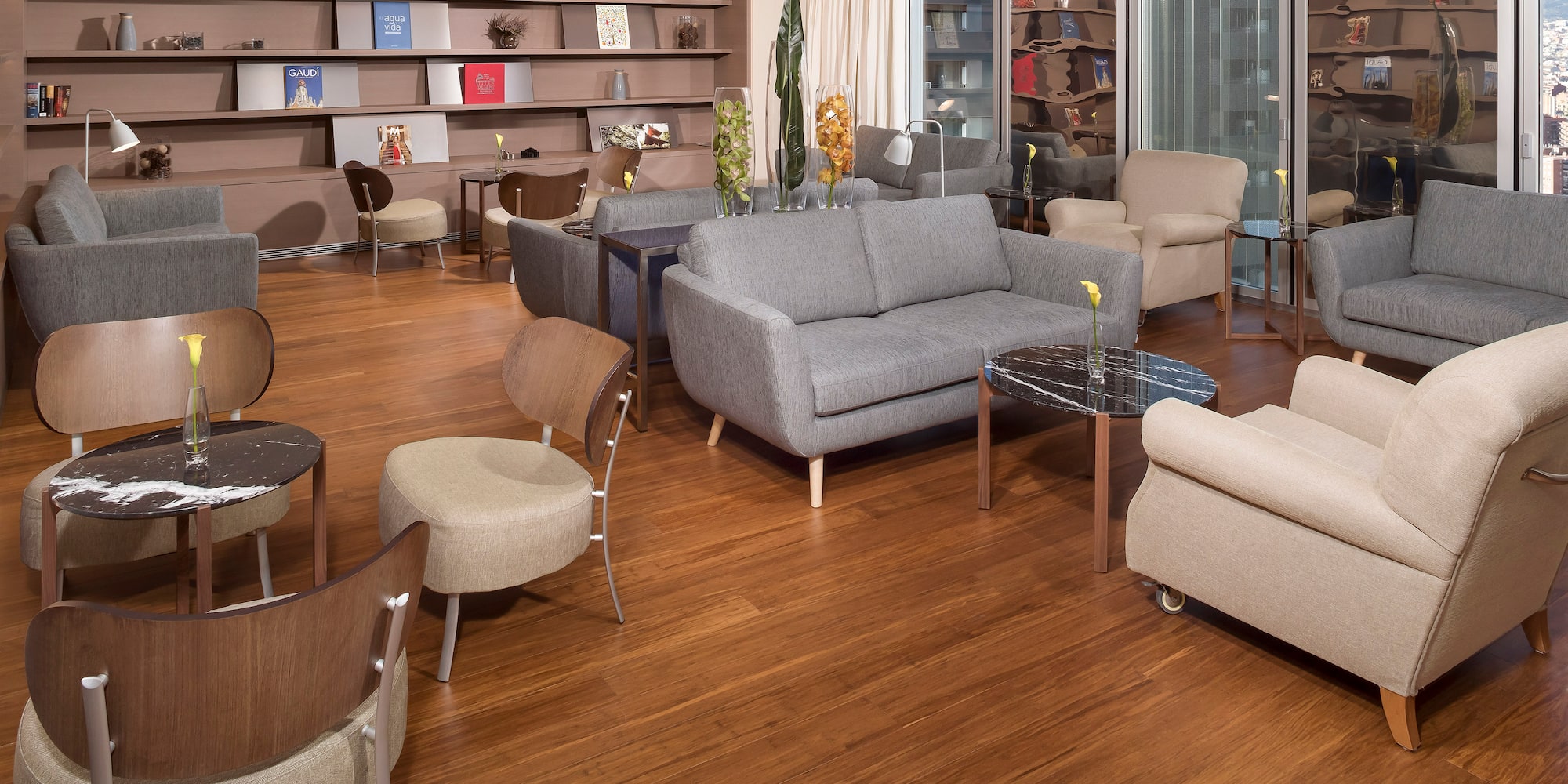 a room with a couch and chairs