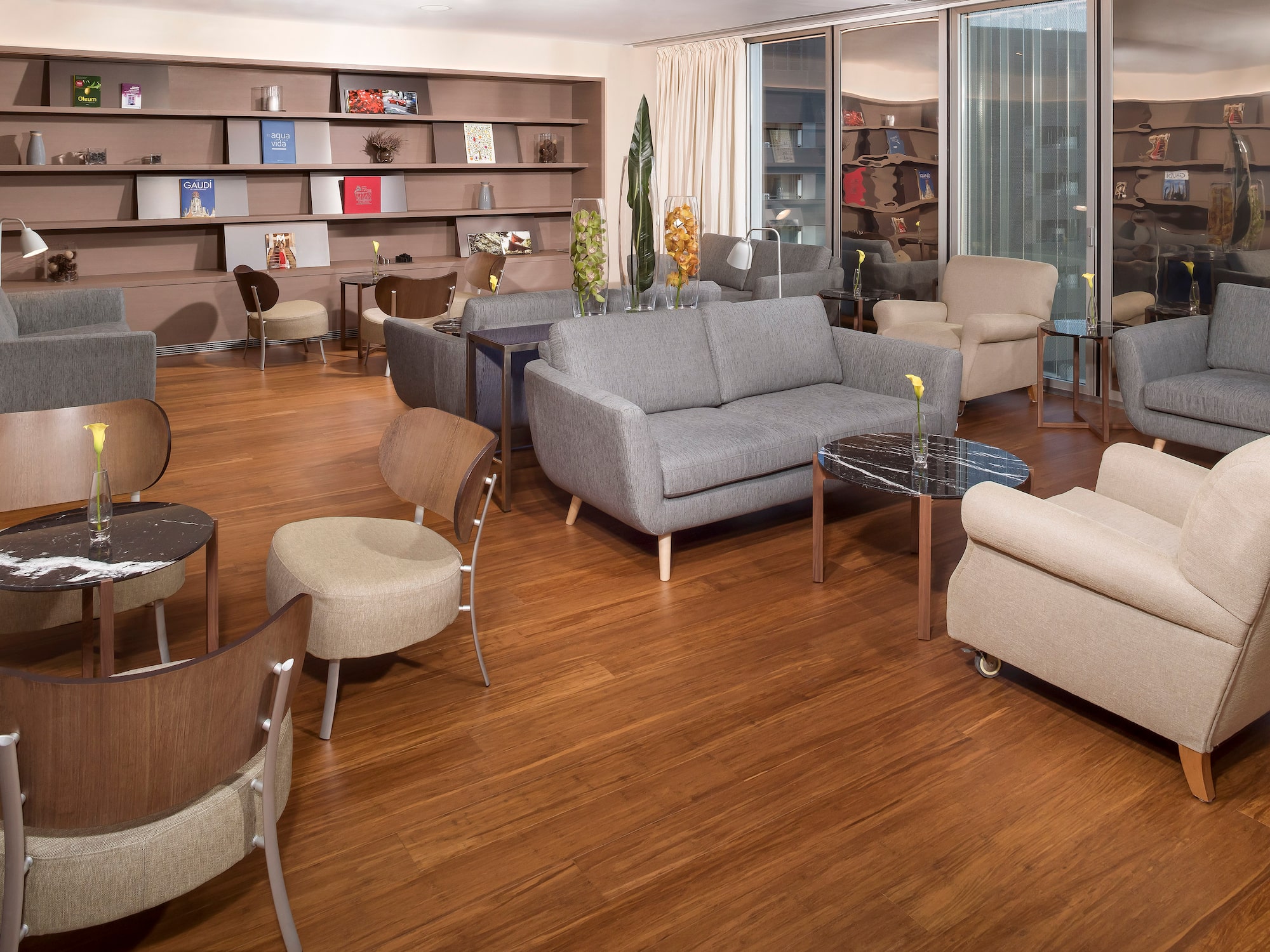 a room with a couch and chairs