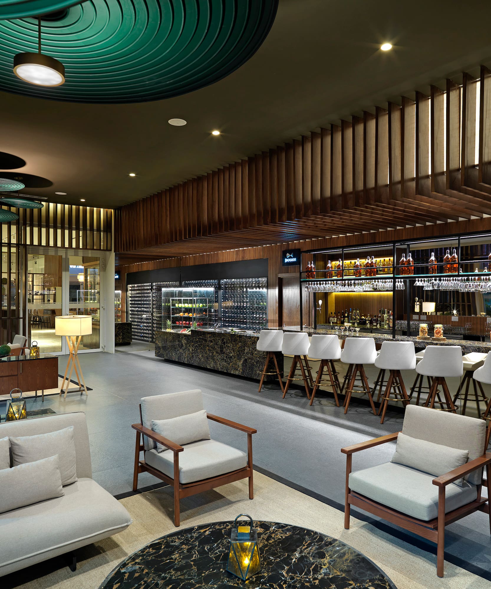 a room with a bar and chairs