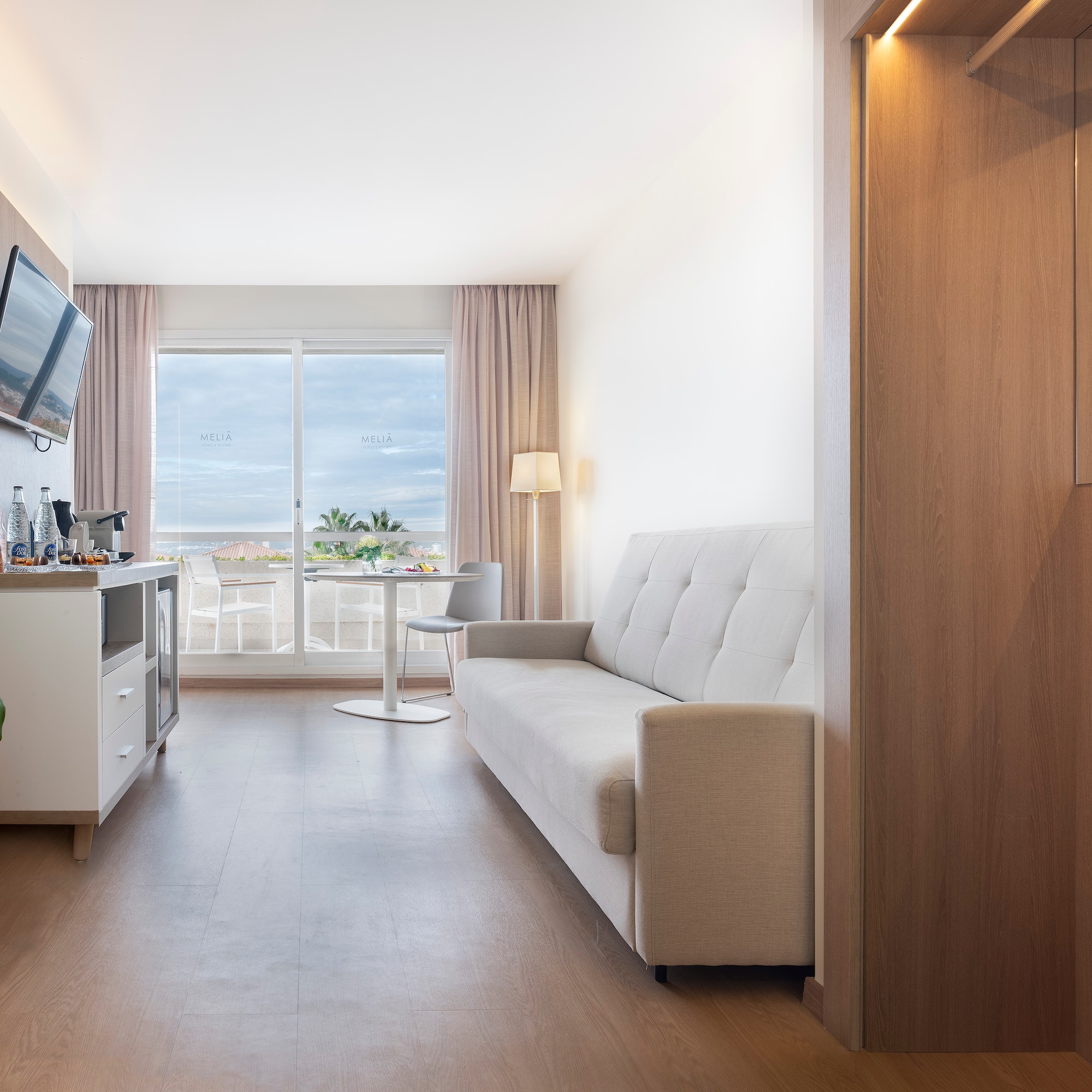 a room with a couch and a television