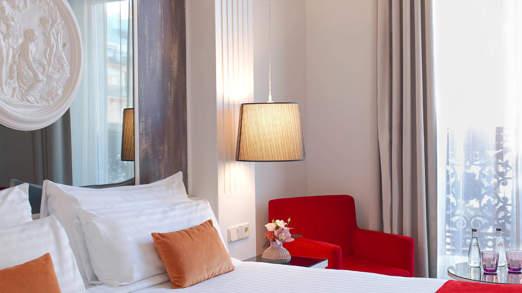 a bedroom with a bed and a chair