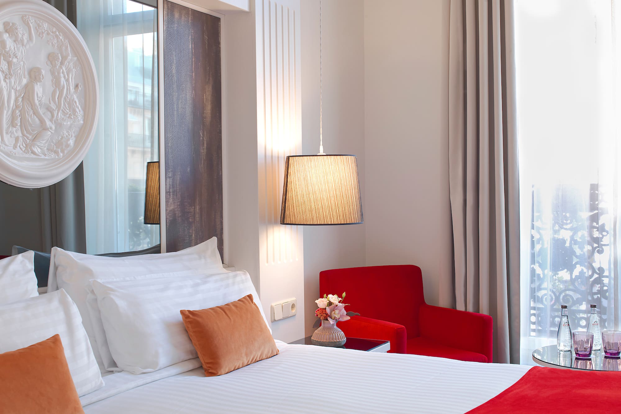 a bedroom with a bed and a chair