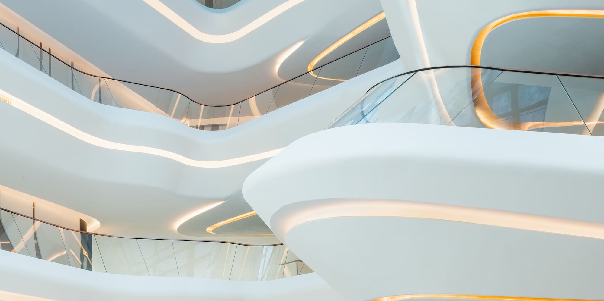 a white building with a glass staircase