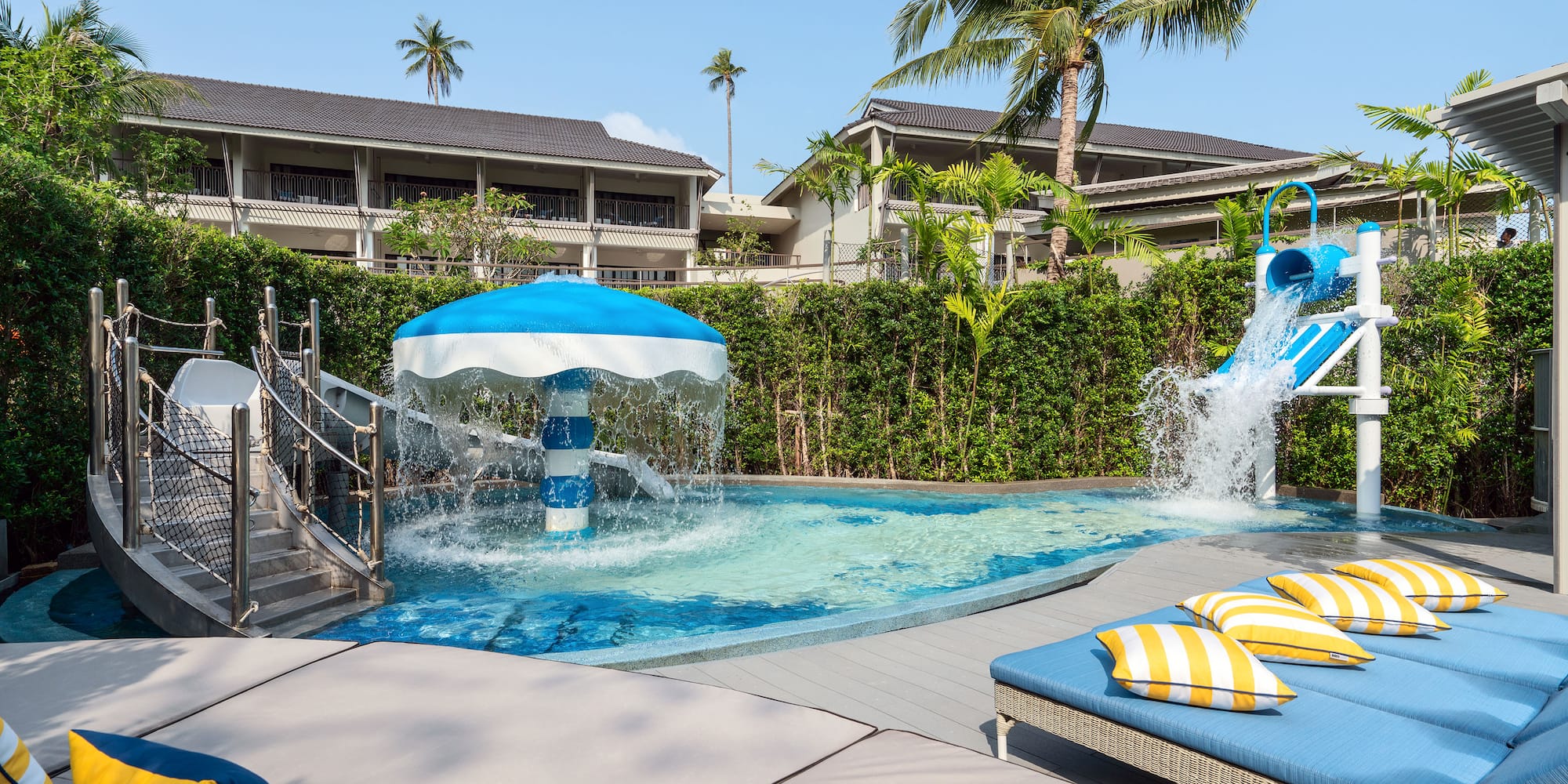 a pool with a water slide and a slide