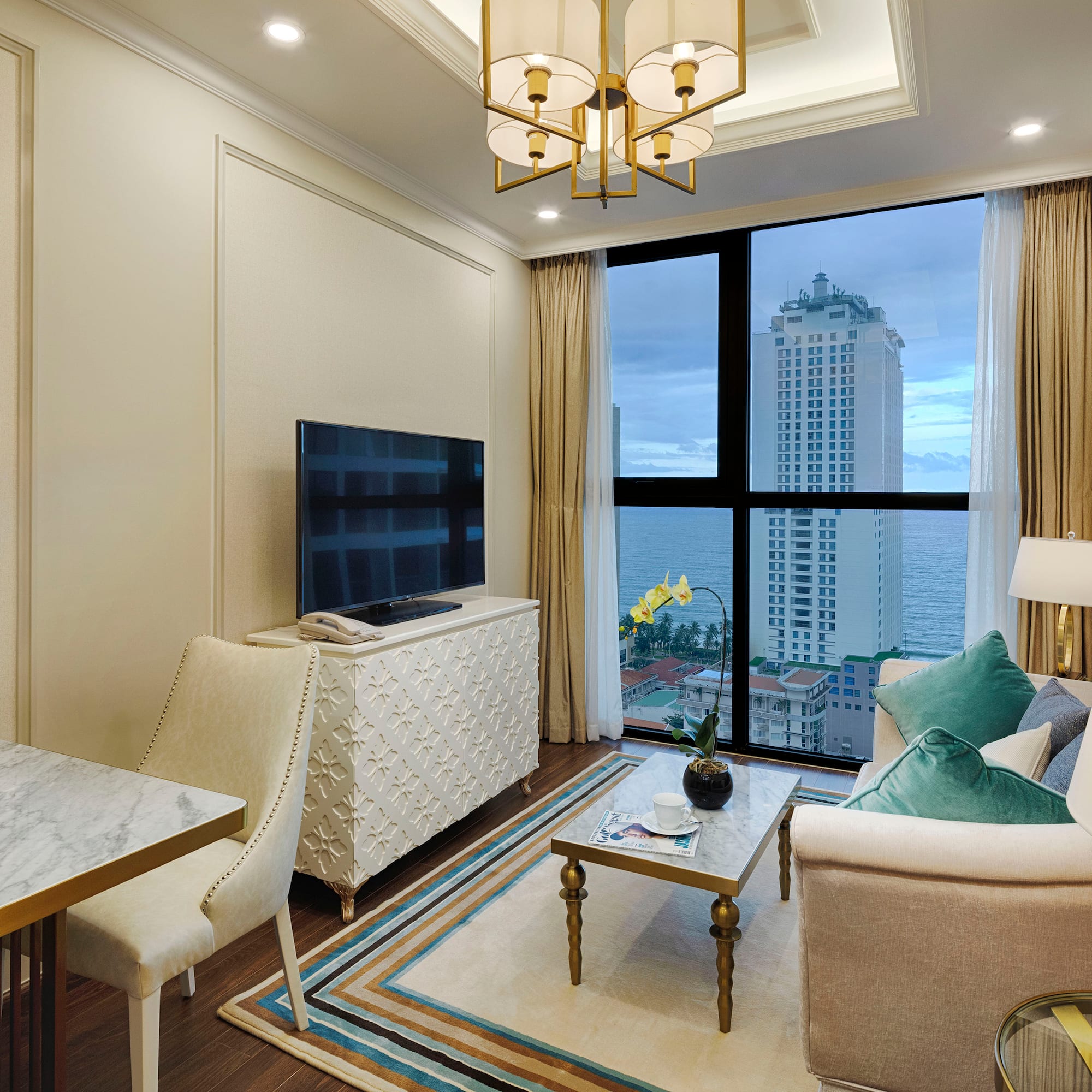 a living room with a large window and a large television