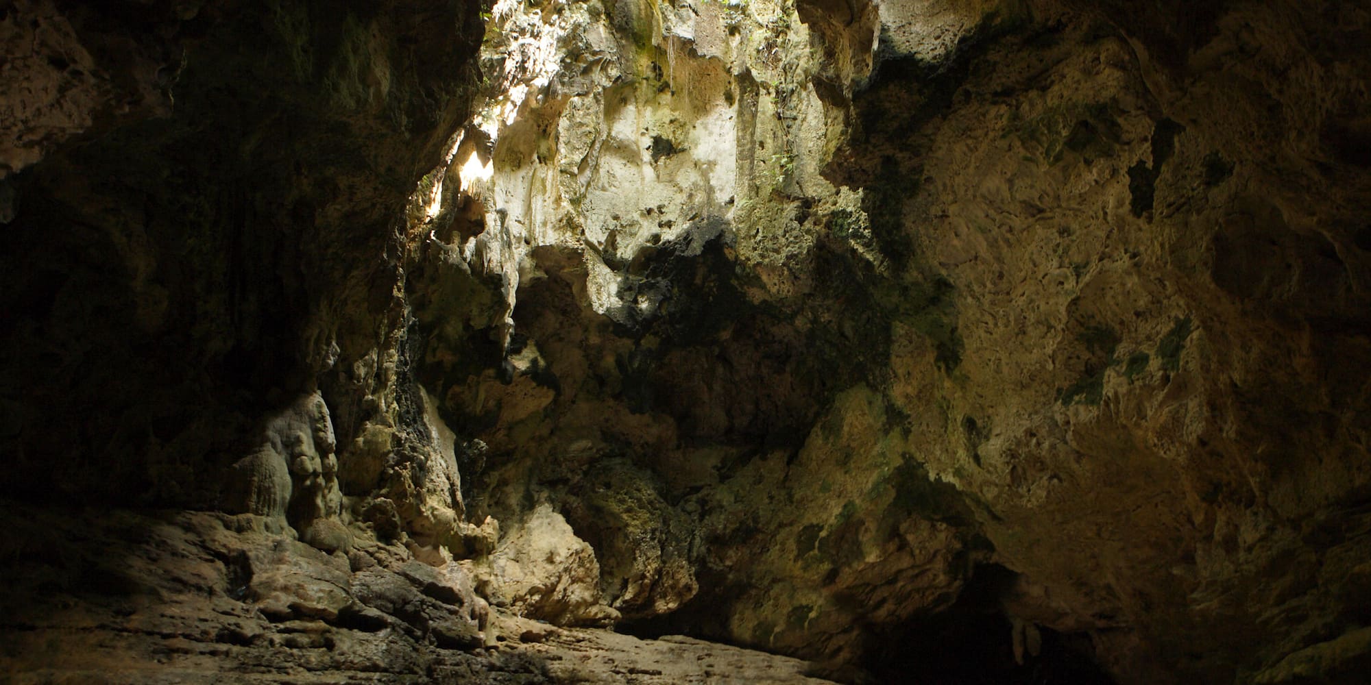 a cave with a hole in the wall