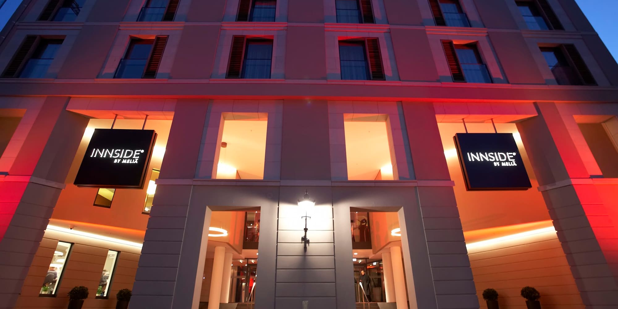 a building with red carpet and signs