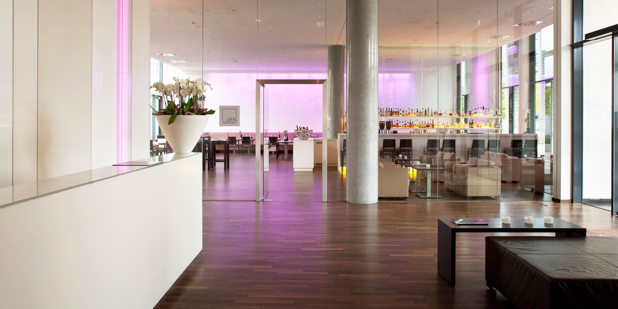 a building with a patio area and umbrellas