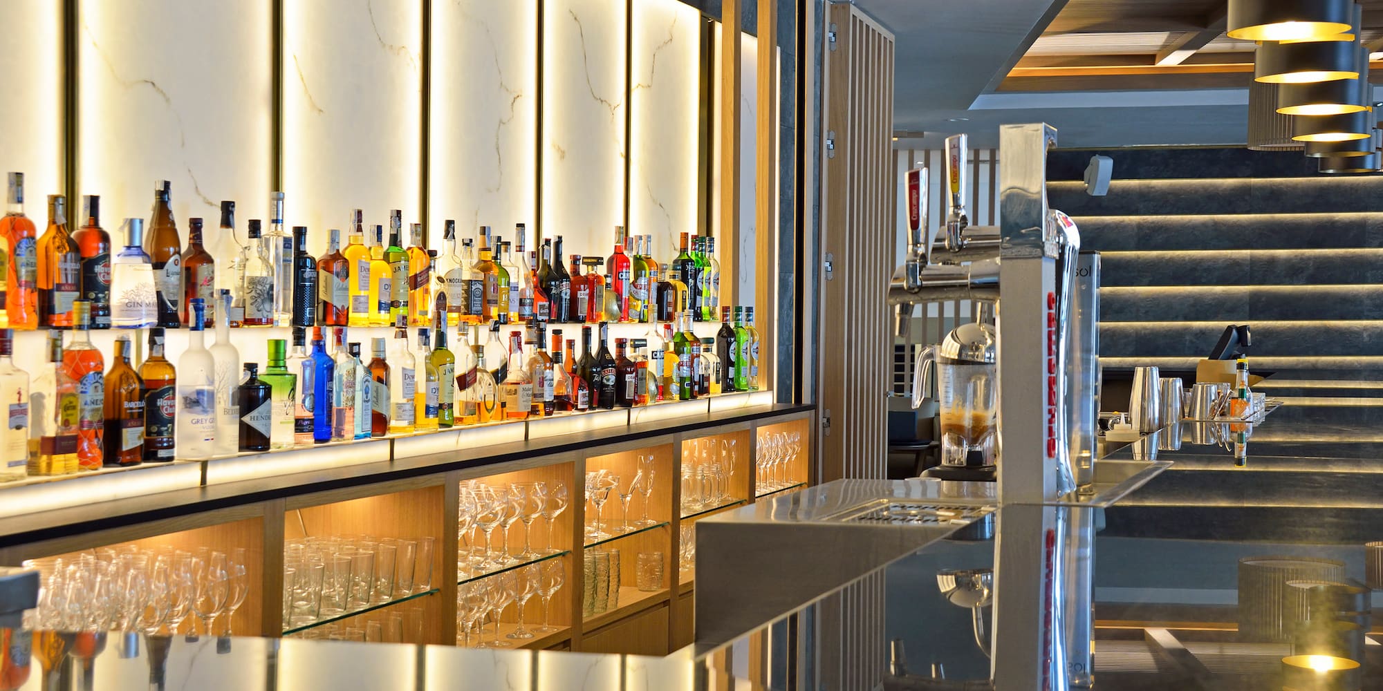 a bar with bottles of alcohol