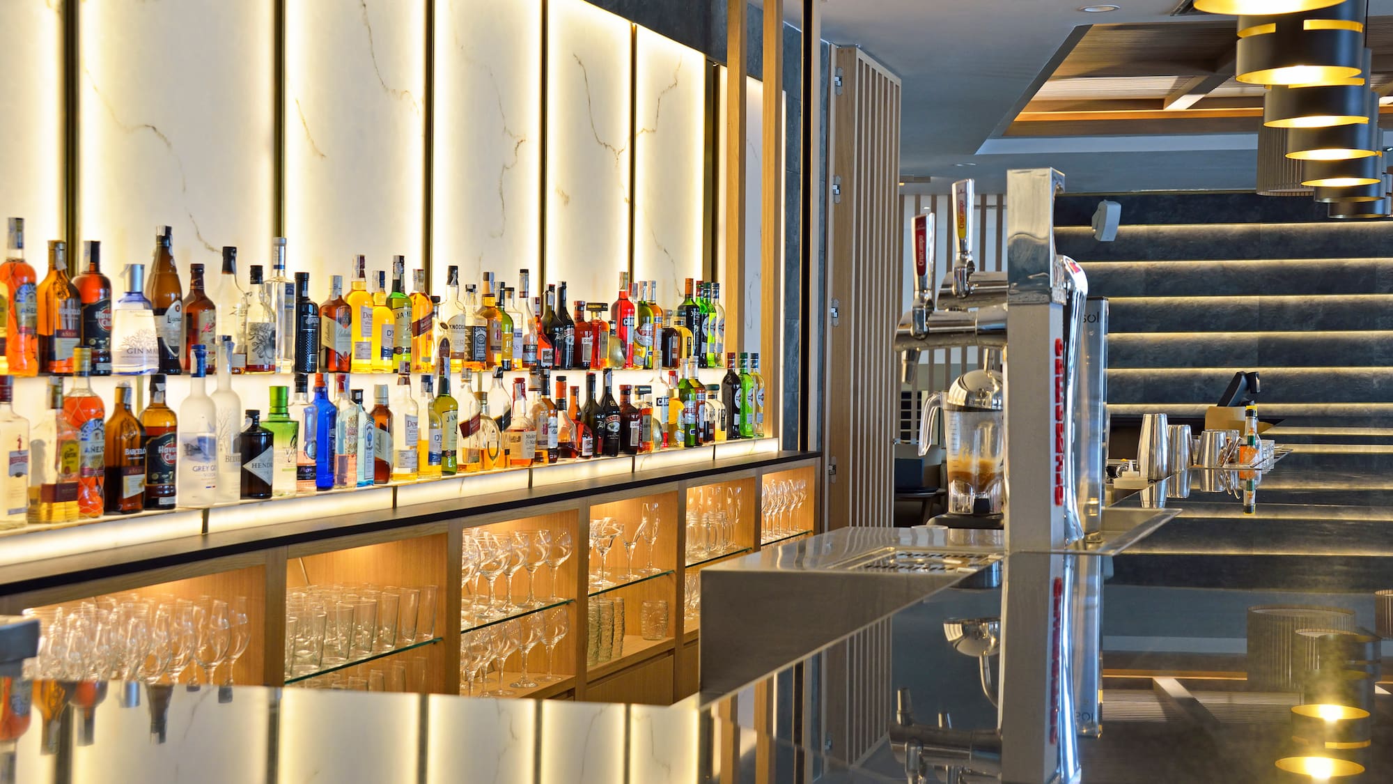 a bar with bottles of alcohol