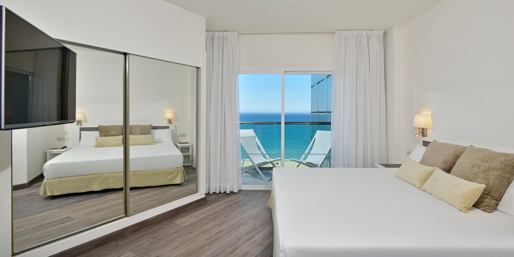 a bedroom with a large sliding glass door