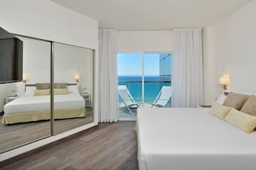 a bedroom with a large sliding glass door