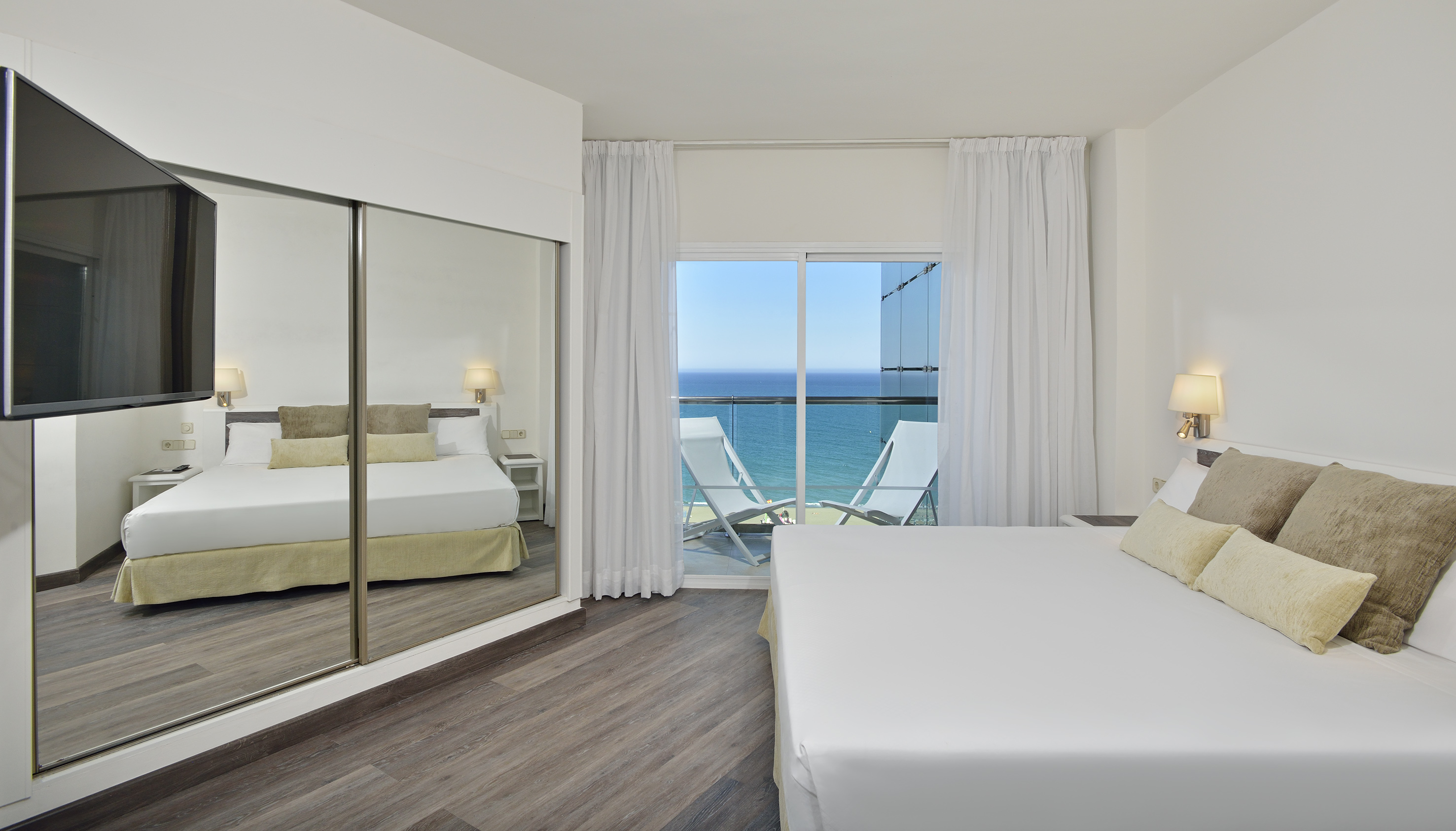 a bedroom with a large sliding glass door