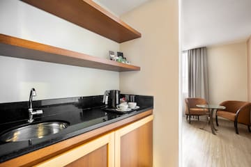 a kitchen with a sink and shelves