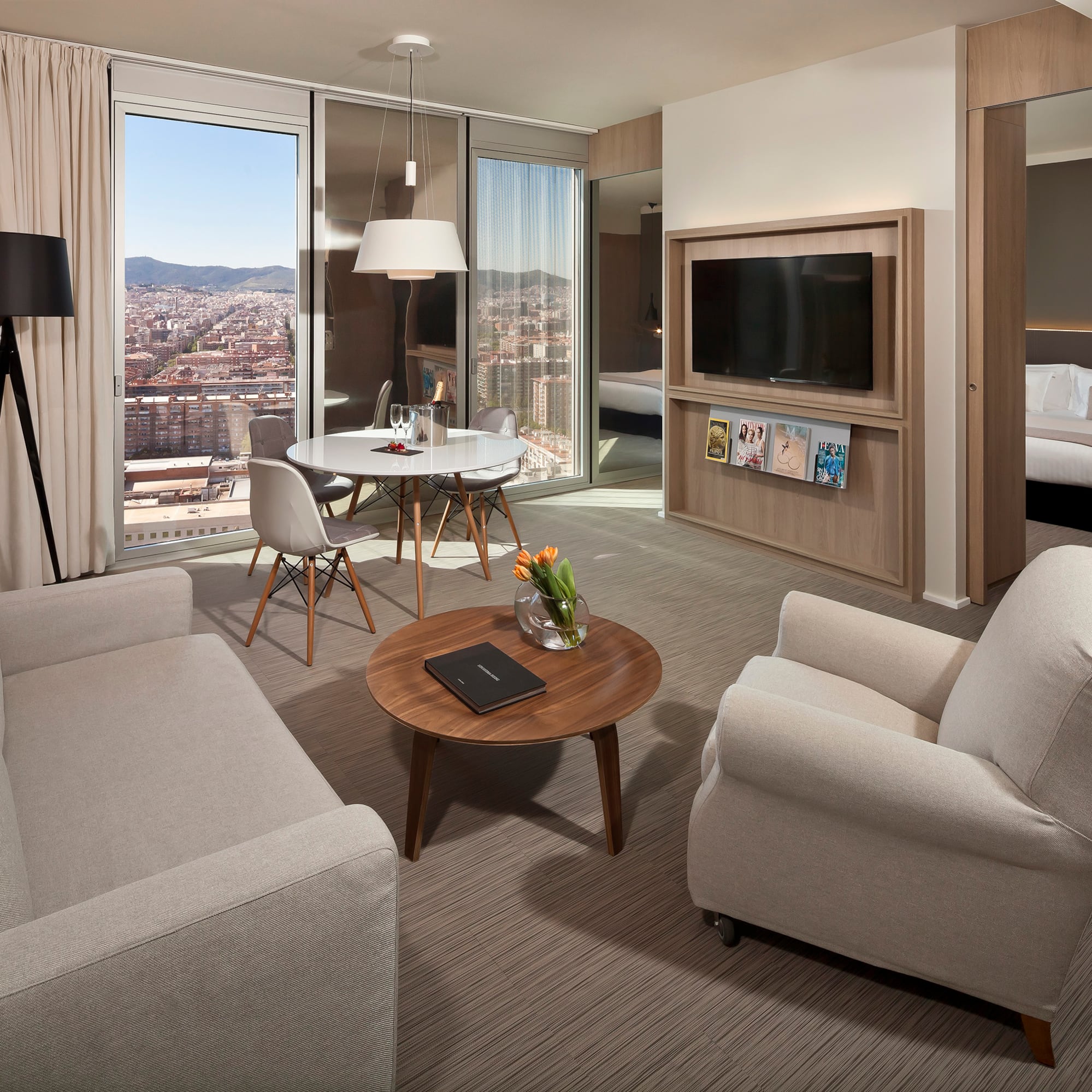 a living room with a table and chairs