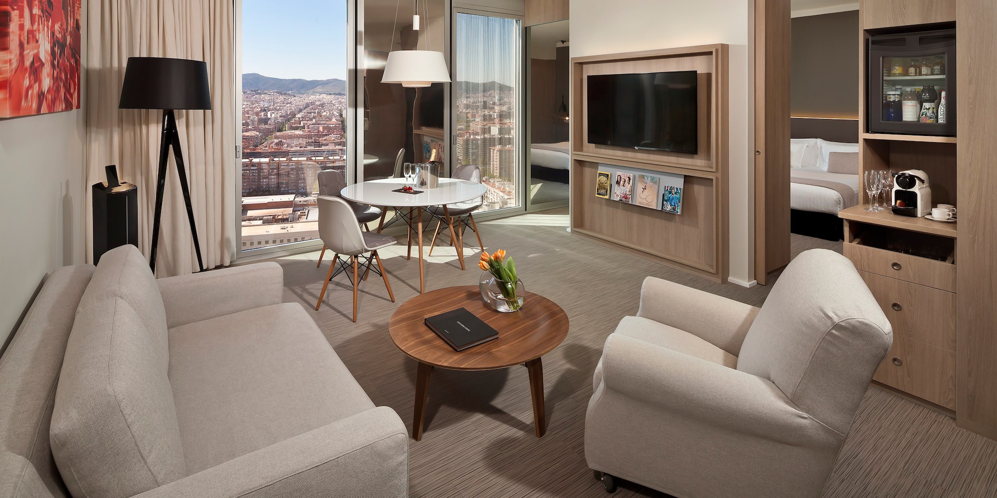 a living room with a table and chairs