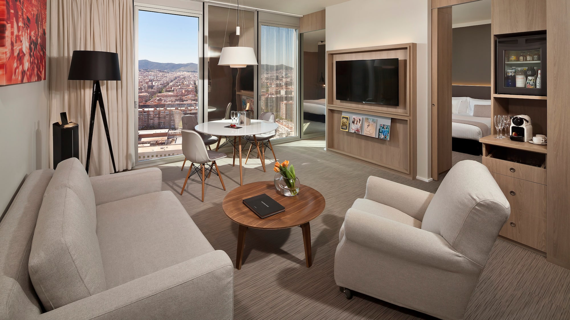 a living room with a table and chairs