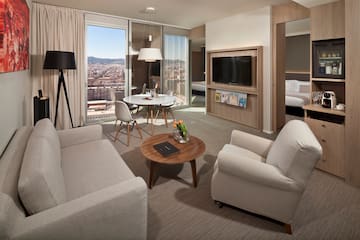 a living room with a table and chairs