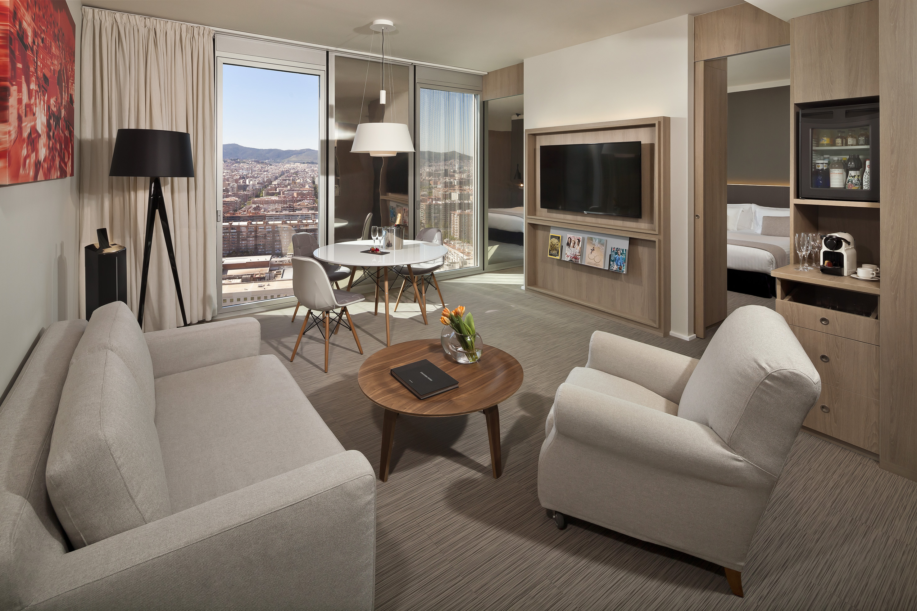 a living room with a table and chairs