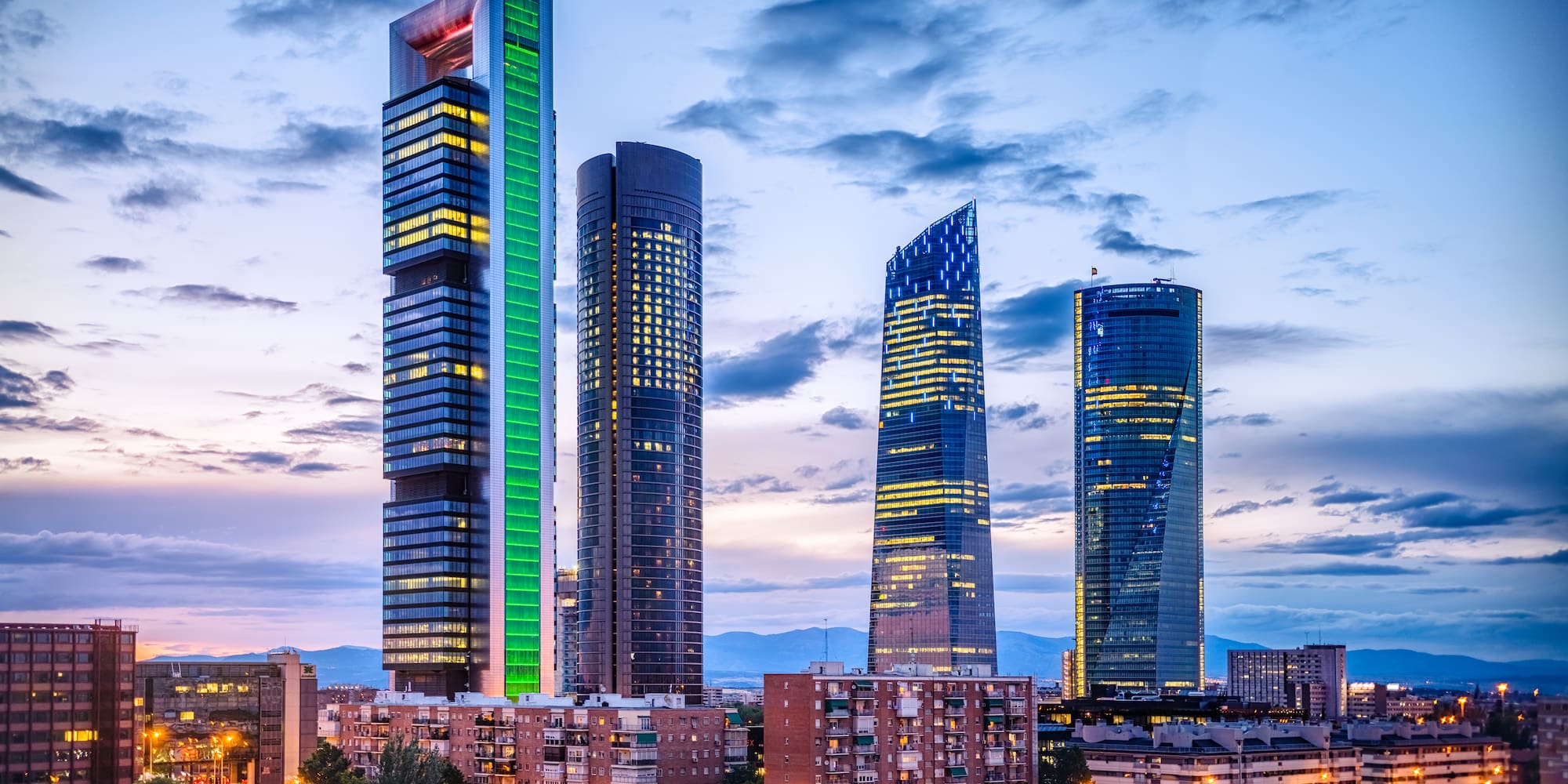 a group of tall buildings in a city