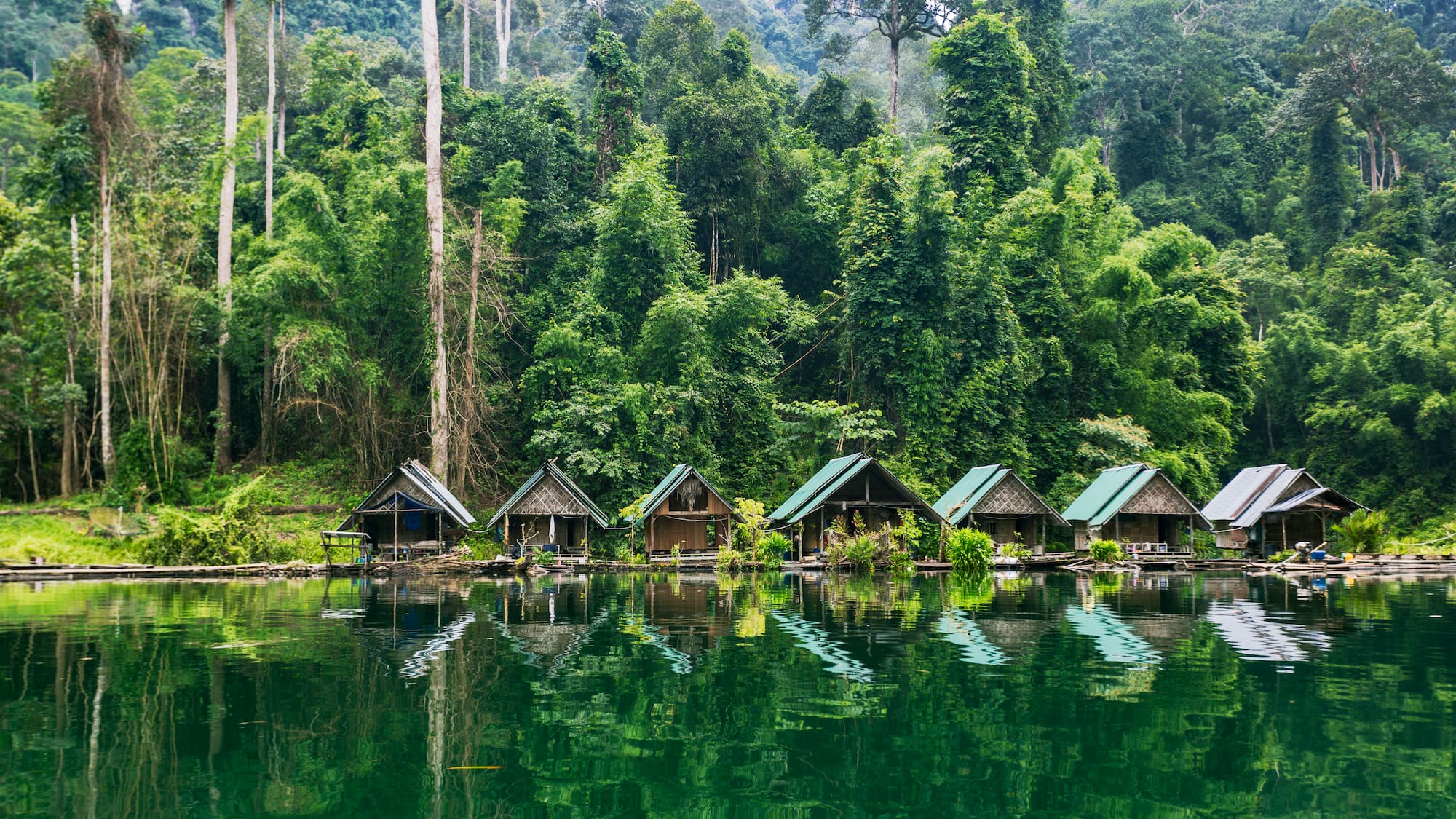 a row of houses on a lake