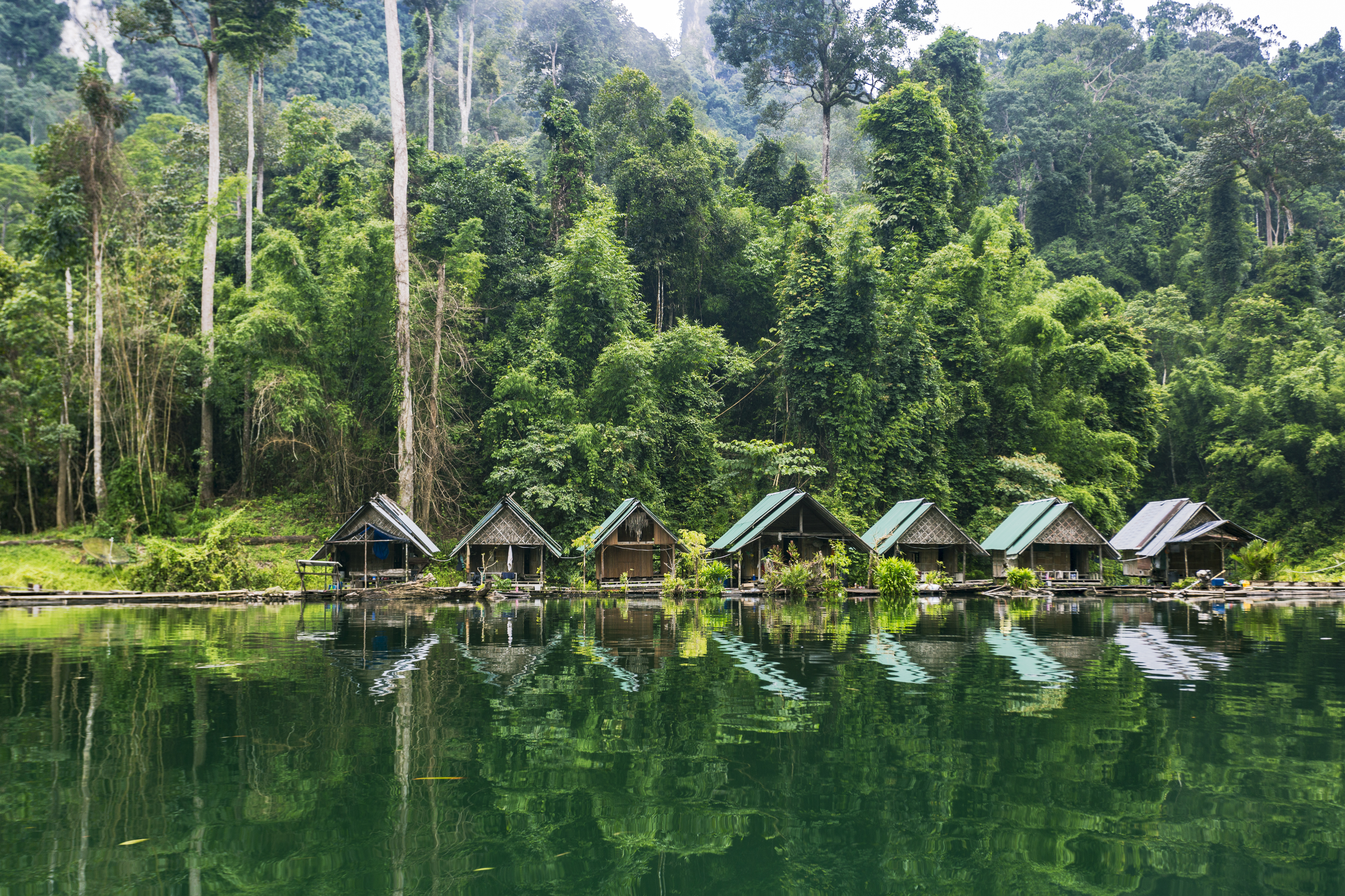a row of houses on a lake