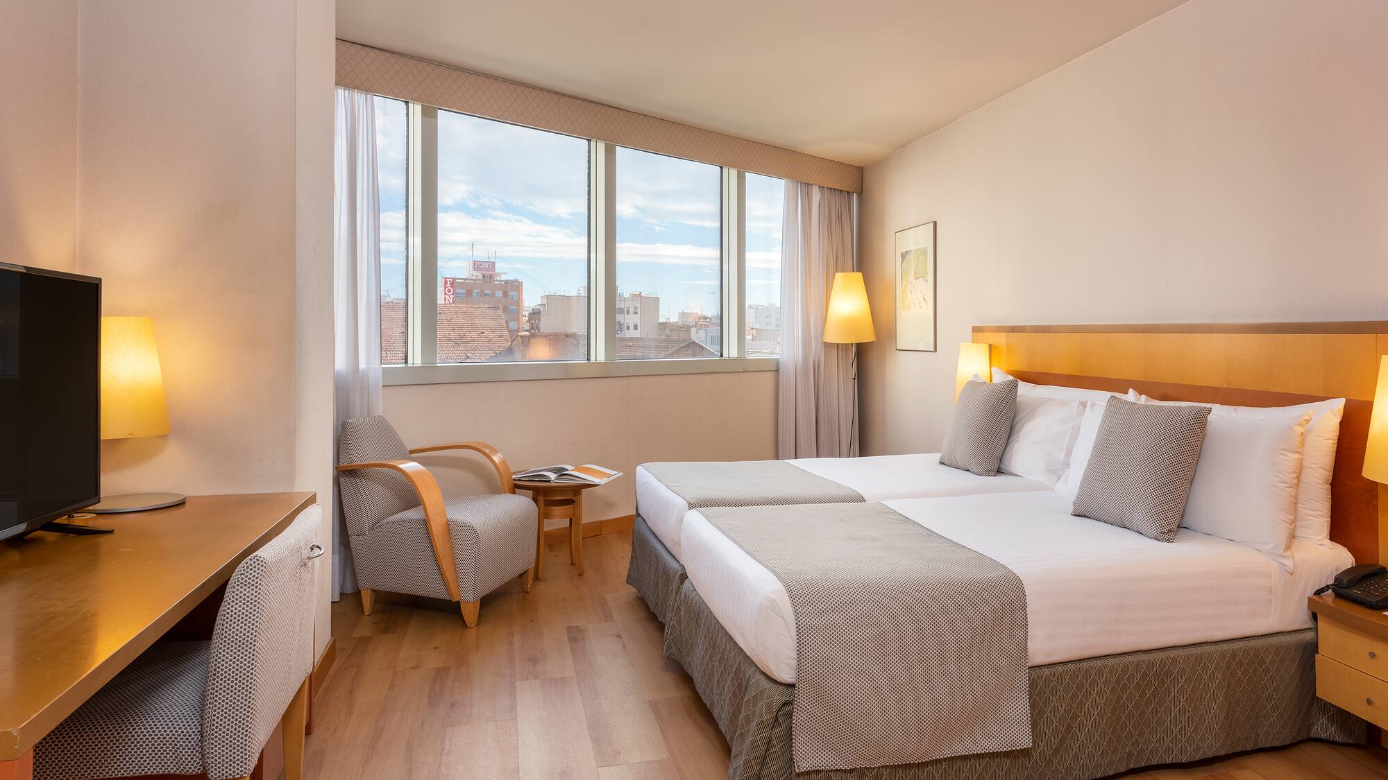 a room with a bed and a chair