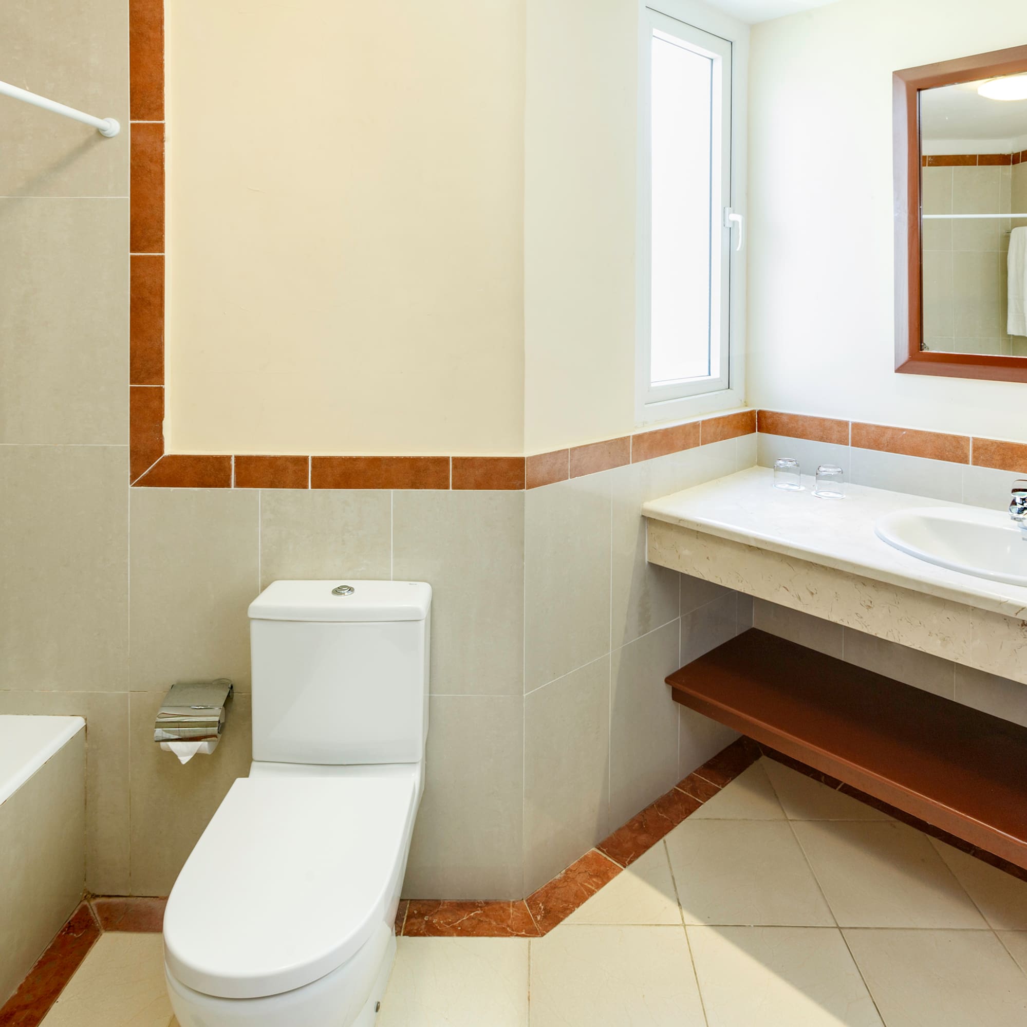 a bathroom with a sink and toilet