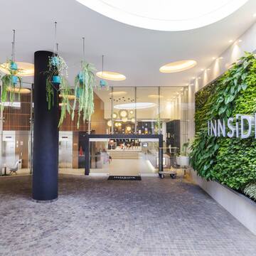 a building with plants on the wall