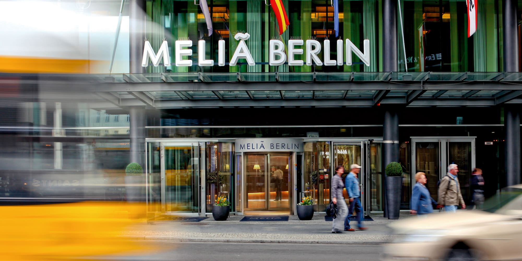 a building with glass doors and a sign