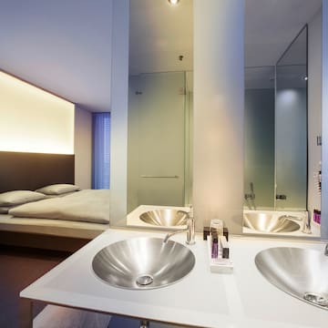 a bathroom with double sink and mirror