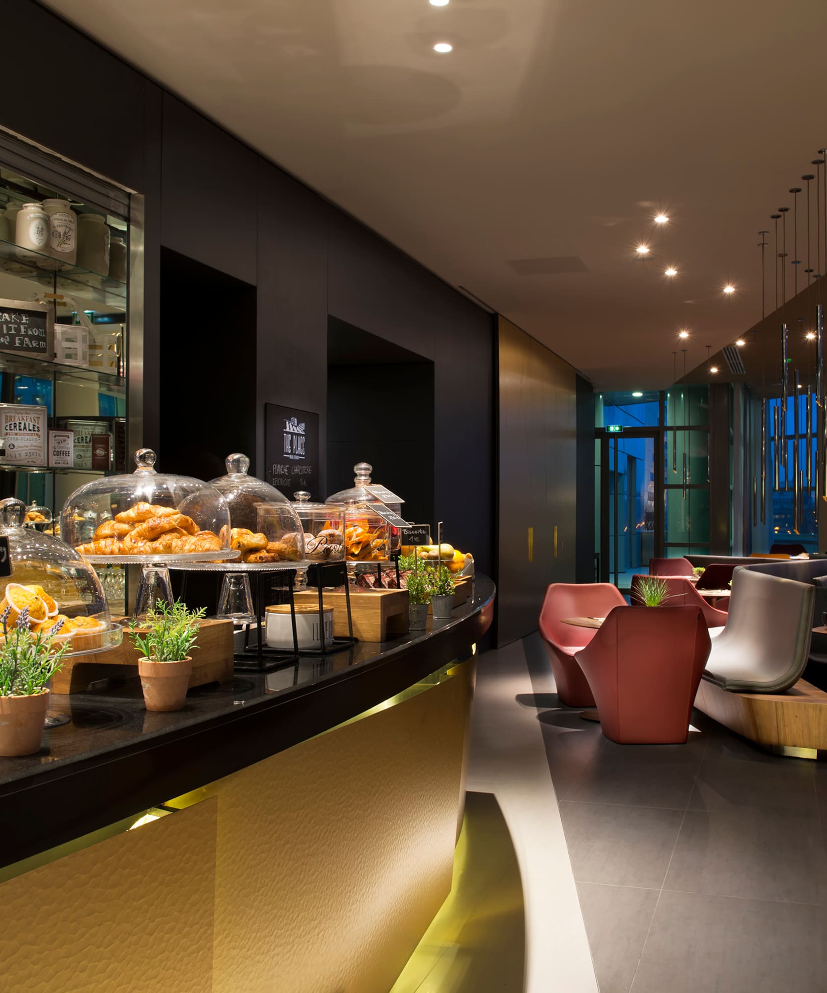 a restaurant with a counter and chairs