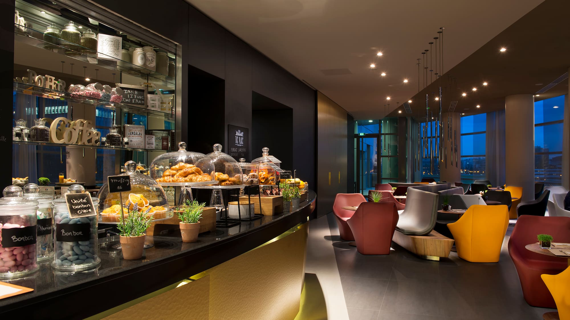 a restaurant with a counter and chairs