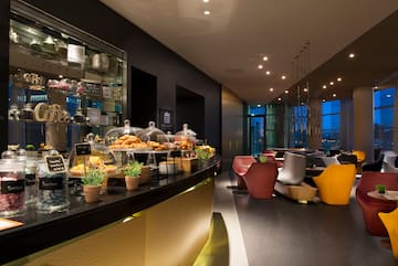 a restaurant with a counter and chairs