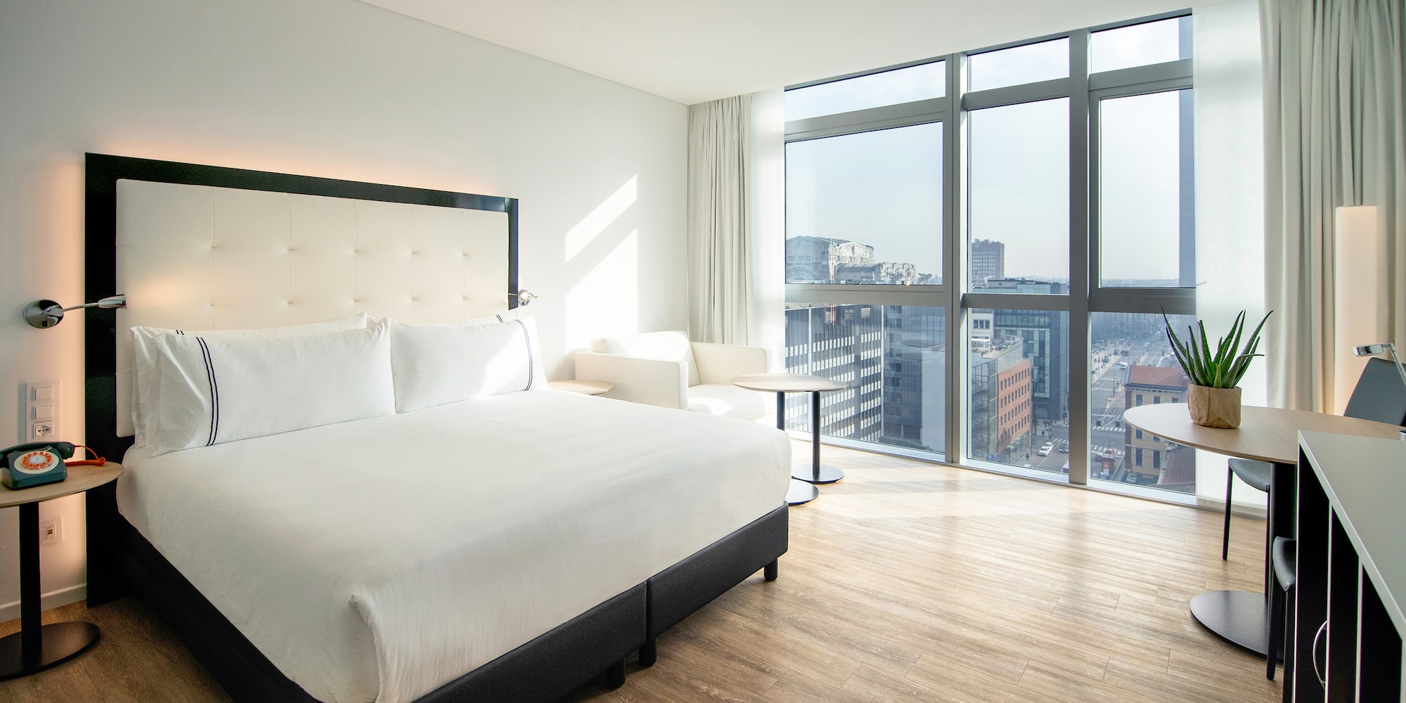 a bedroom with a large window