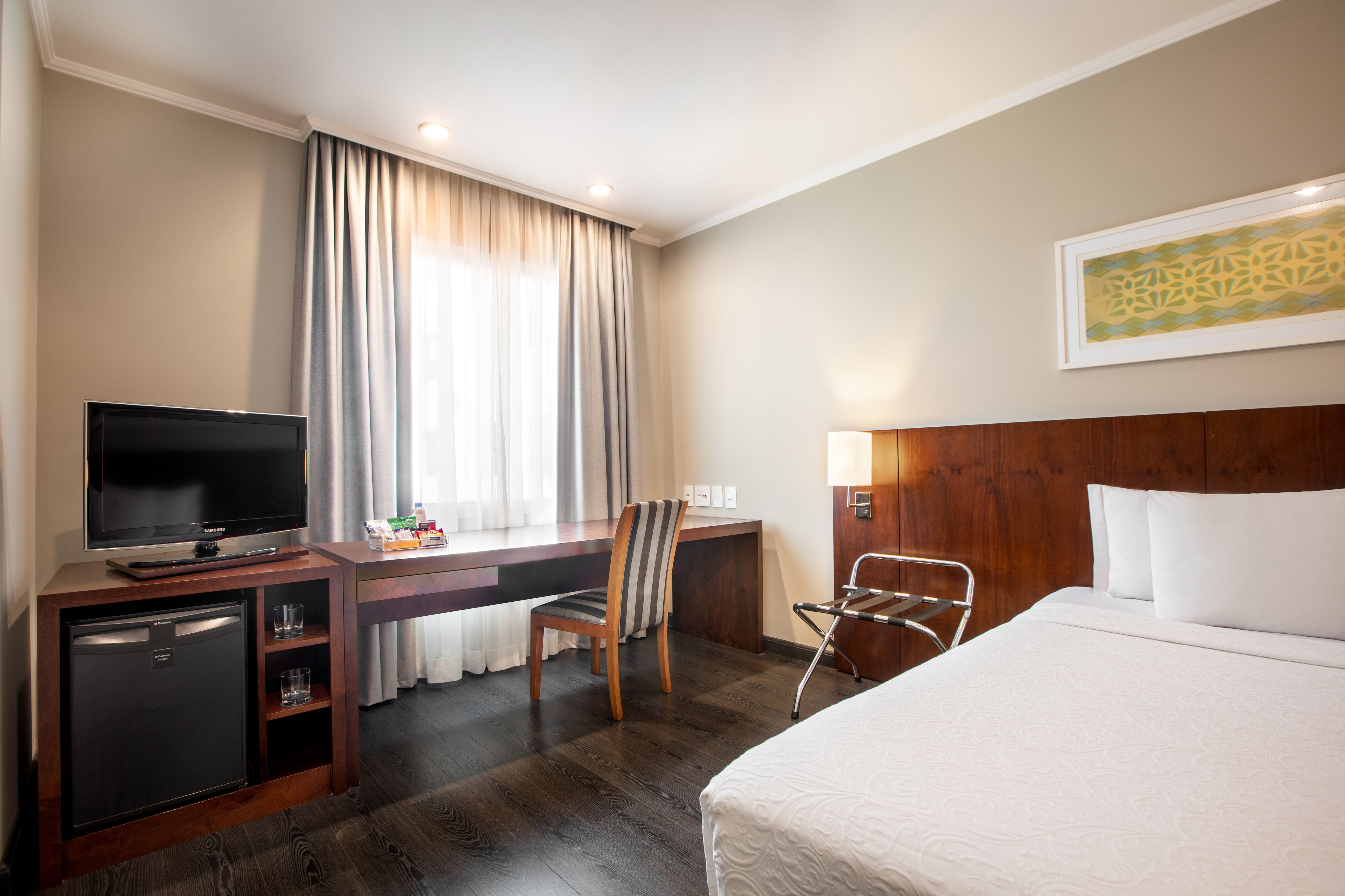 a room with a bed and a desk