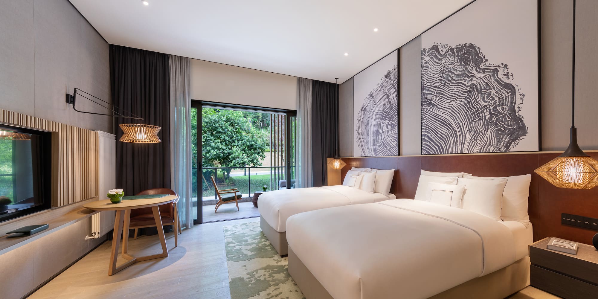 a room with two beds and a table