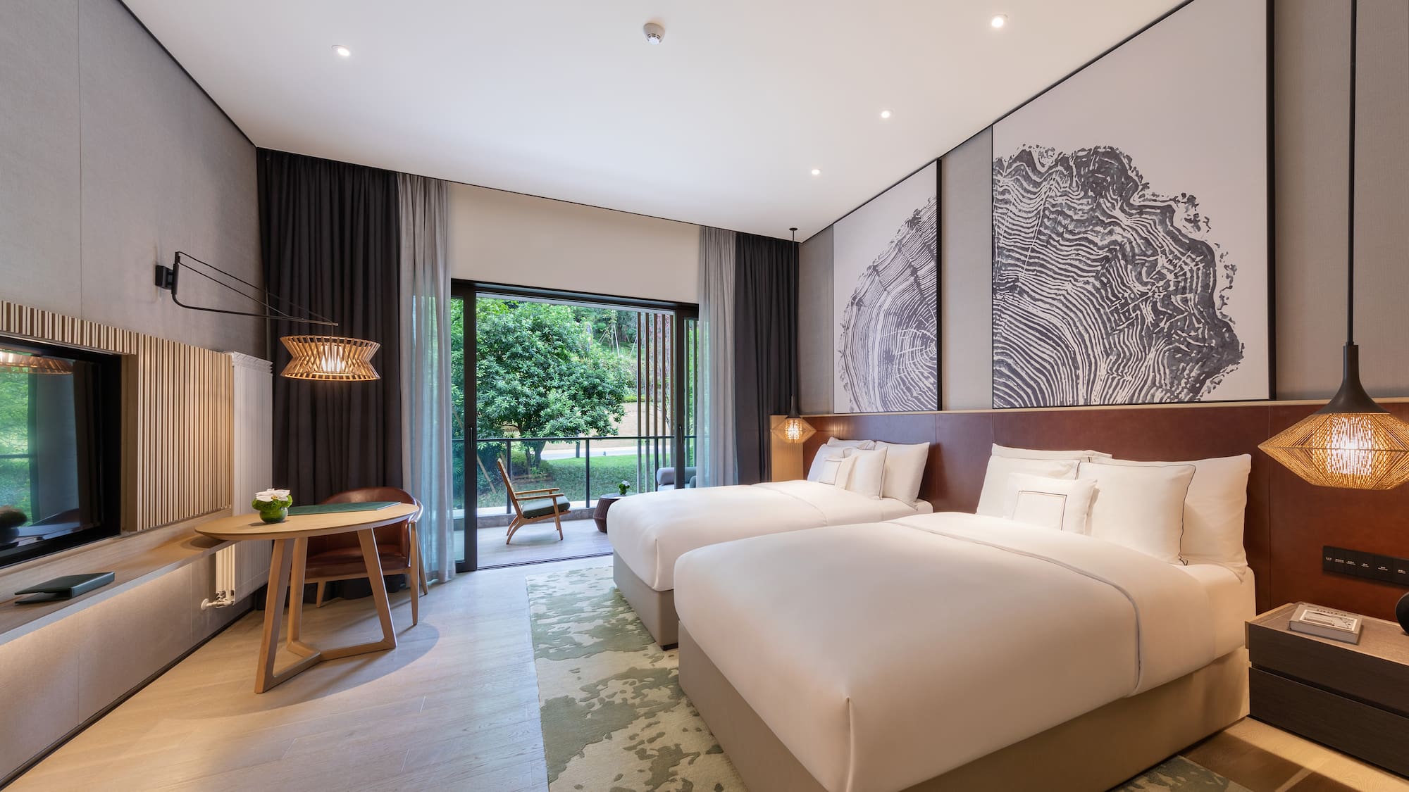 a room with two beds and a table