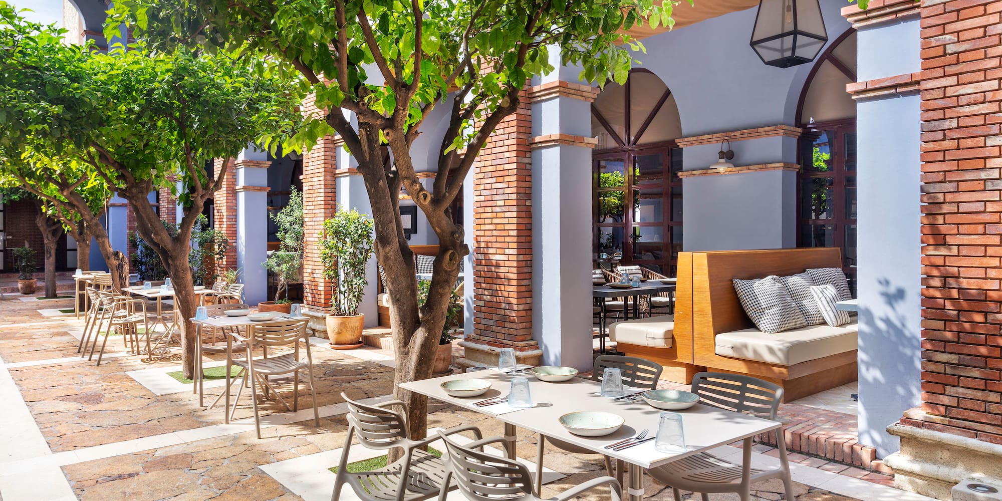 a patio with tables and chairs