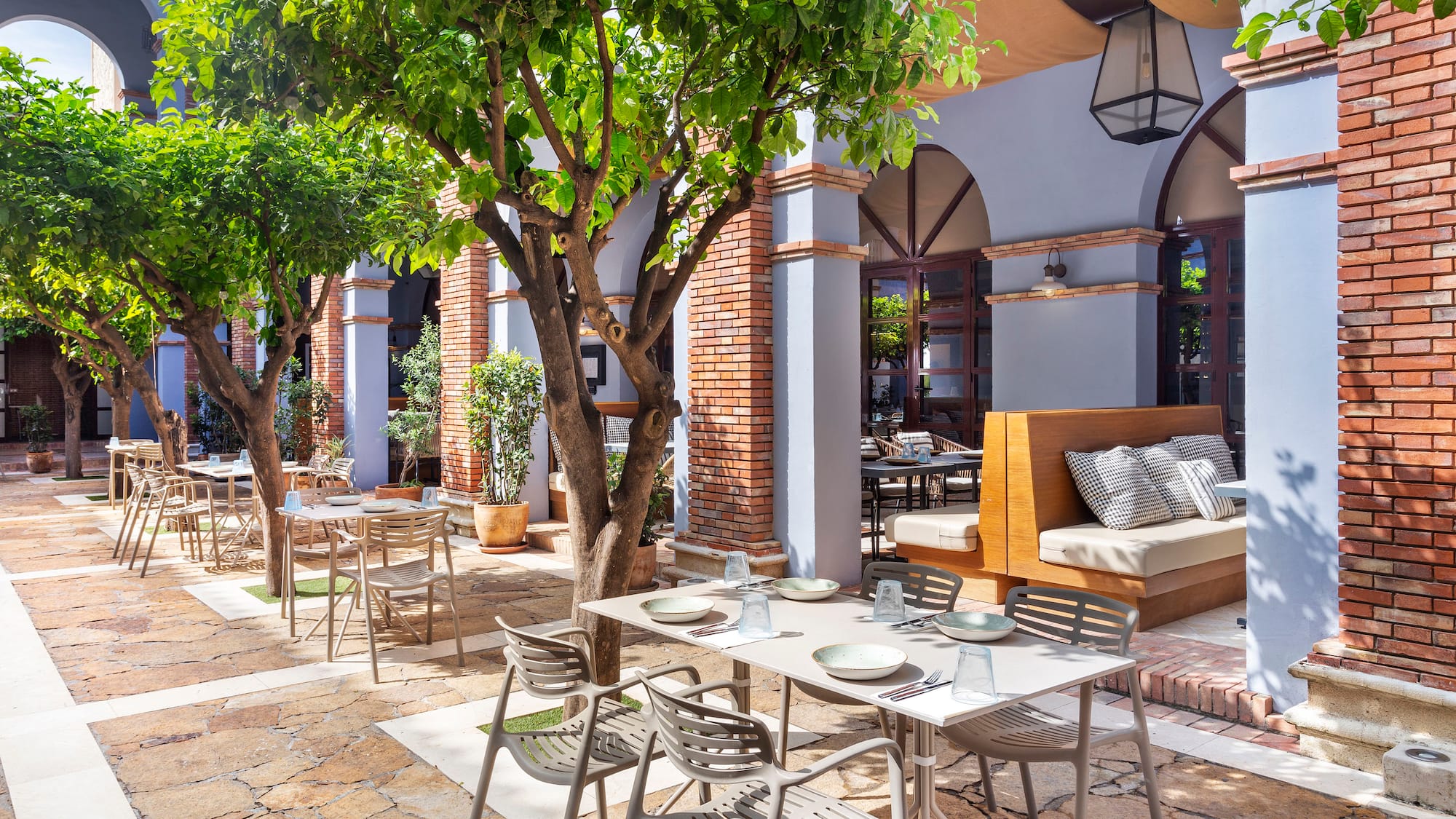 a patio with tables and chairs