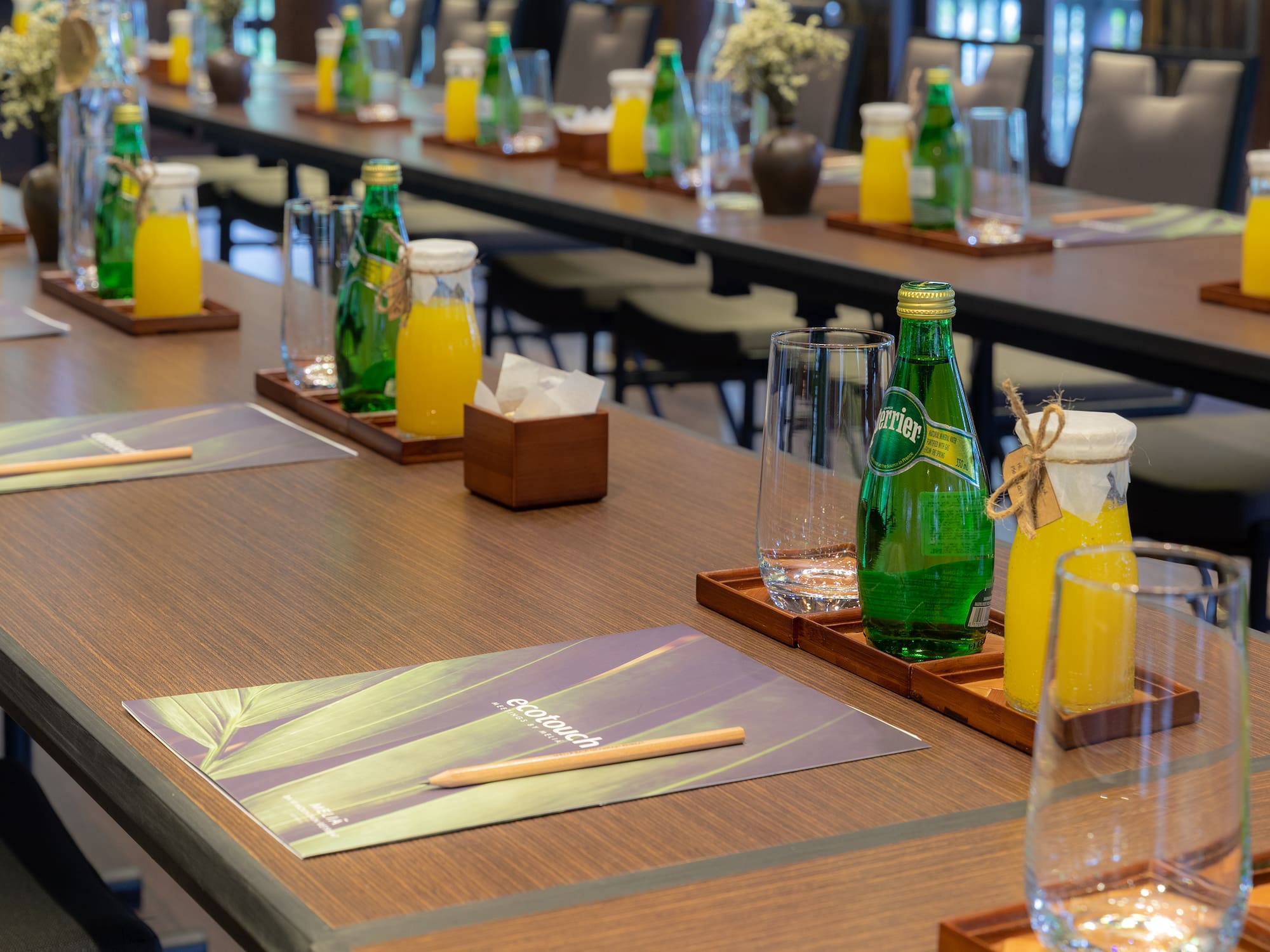 a table with glasses and bottles of juice
